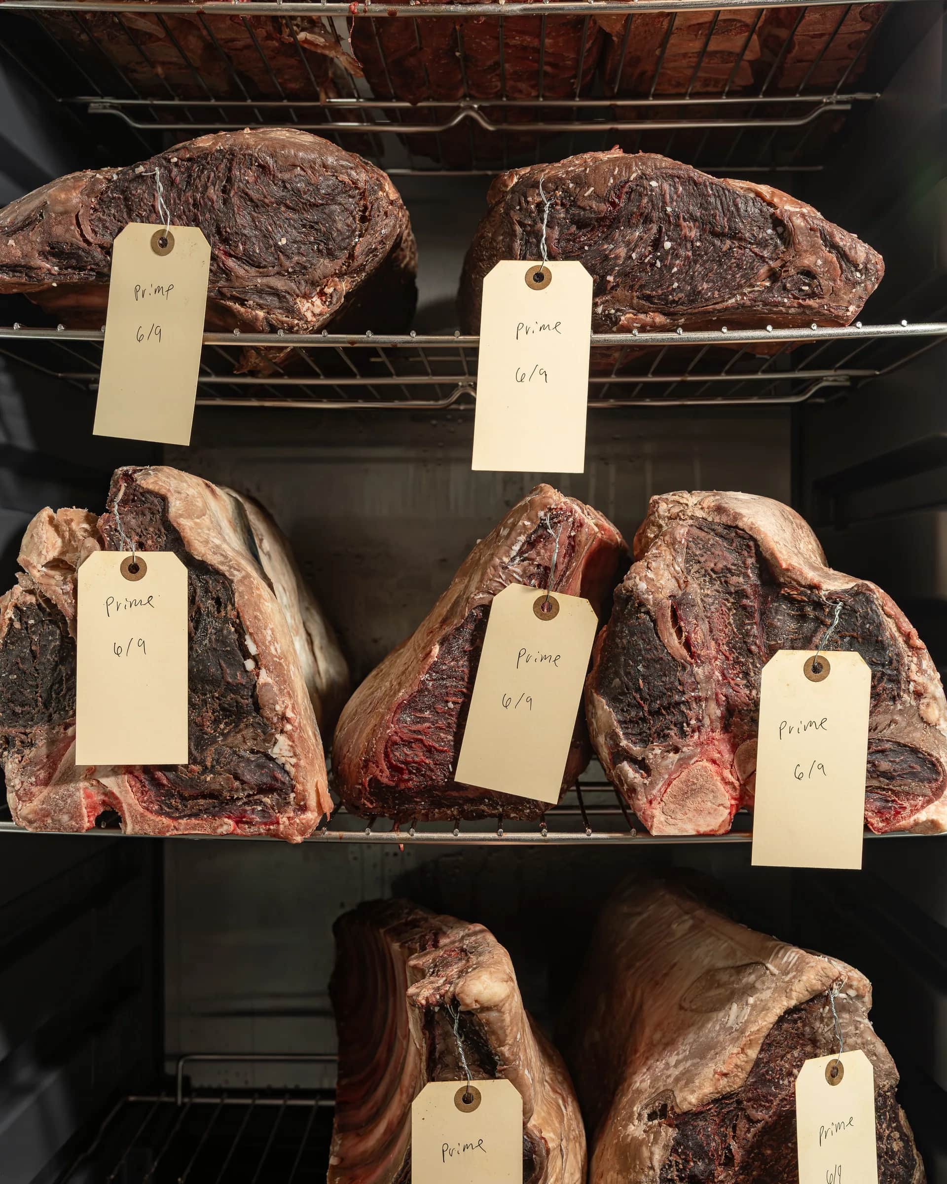 Prime dry-age tags on the shelf